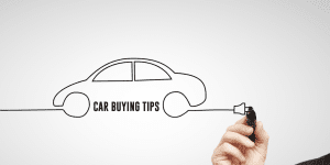 Plan your car loan budget Man drawing a car with car buying tips written