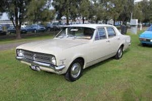 A Cream Holden Kingswood on Grass